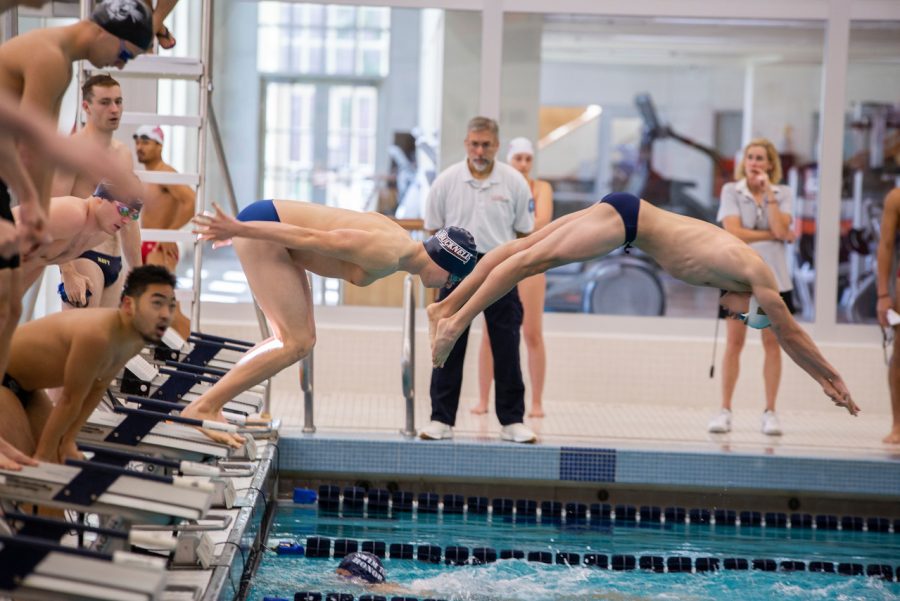 Men’s and women’s swimming both win two out of three at quad meet